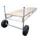 Cart with wooden platform and large wheels on a white background