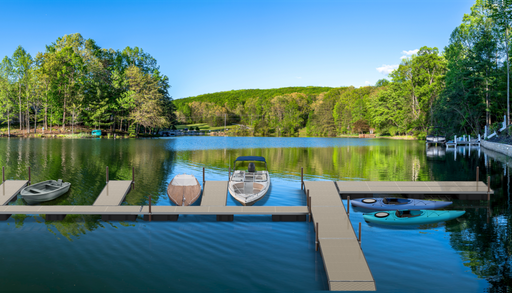 Lake with dock and boats surrounded by trees on a clear day