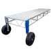 Metal platform cart with large wheels on a white background