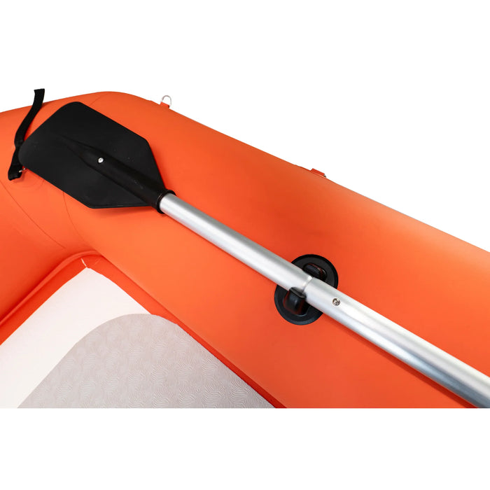 Orange inflatable kayak with a black paddle on a white background