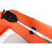 Orange inflatable kayak with a black paddle on a white background