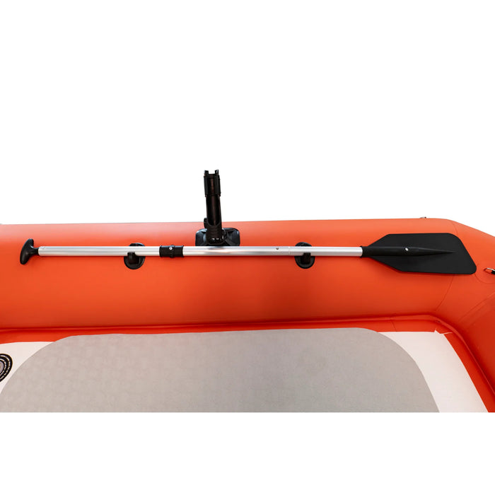 Orange inflatable kayak with a paddle on a white background