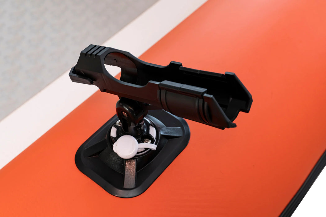 Black suction cup mount on an orange surface