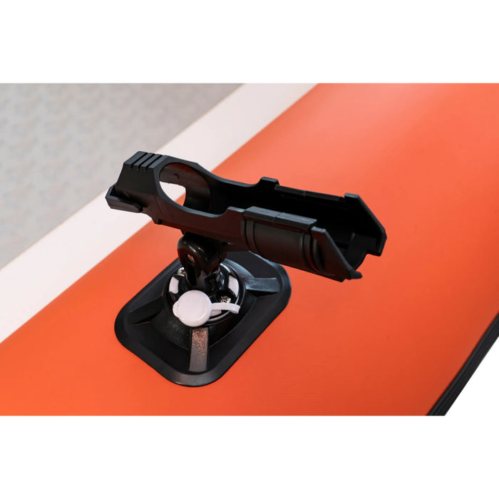 Black suction cup mount on an orange surface