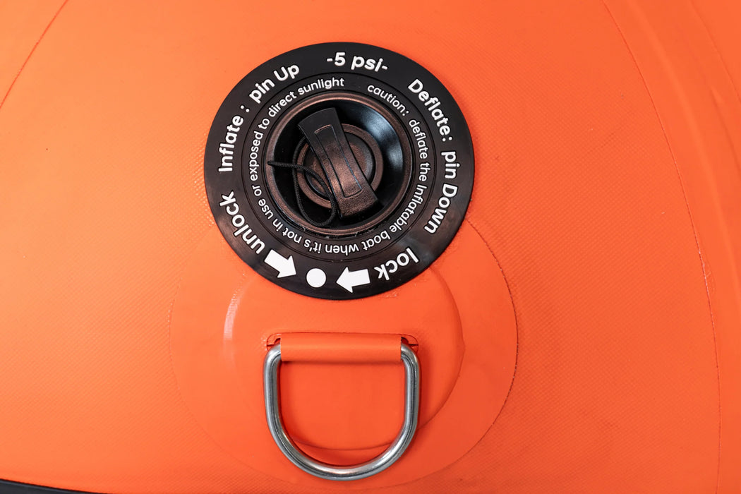 Close-up of an orange inflator with a black valve and metal handle on a matching orange background.