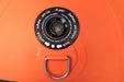 Close-up of an orange inflator with a black valve and metal handle on a matching orange background.