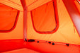 Close-up of an orange tent interior with a focus on the fabric and structure.