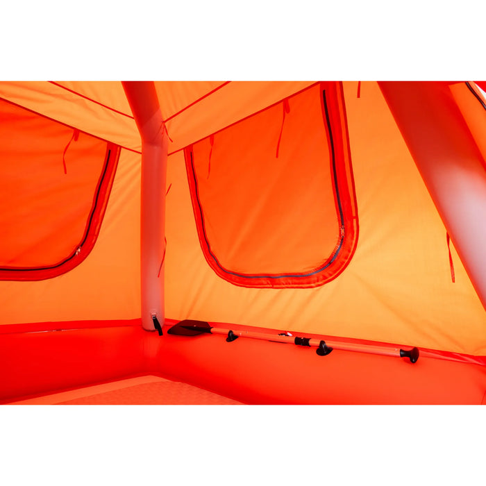Close-up of an orange tent interior with a focus on the fabric and structure.