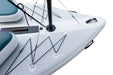 Close-up of a sailboat's deck with ropes and white hull