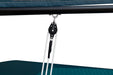 Close-up of a black pulley system attached to a blue canopy.