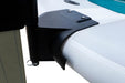 Close-up of a black car spoiler on a white car with a blurred background