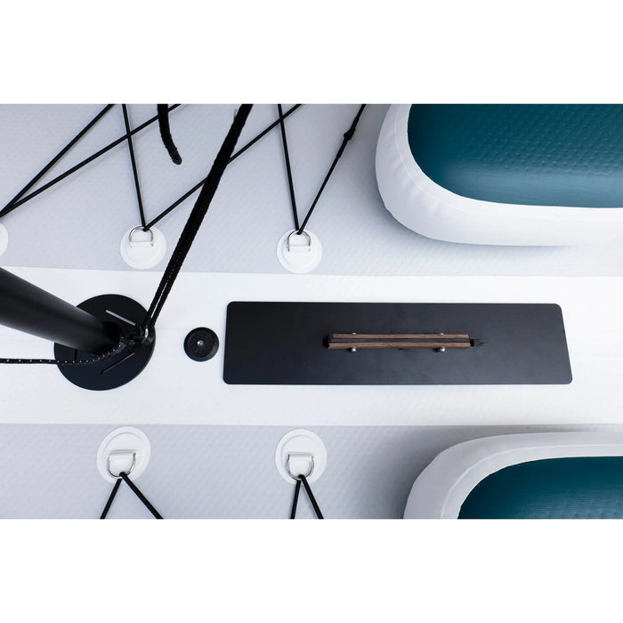 Close-up of a desk setup with a pen on a black mat, surrounded by office furniture.
