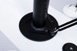 Black adjustable stand on a white surface
