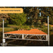 Wooden dock on water with trees in the background, branded 'Patriot Docks'.