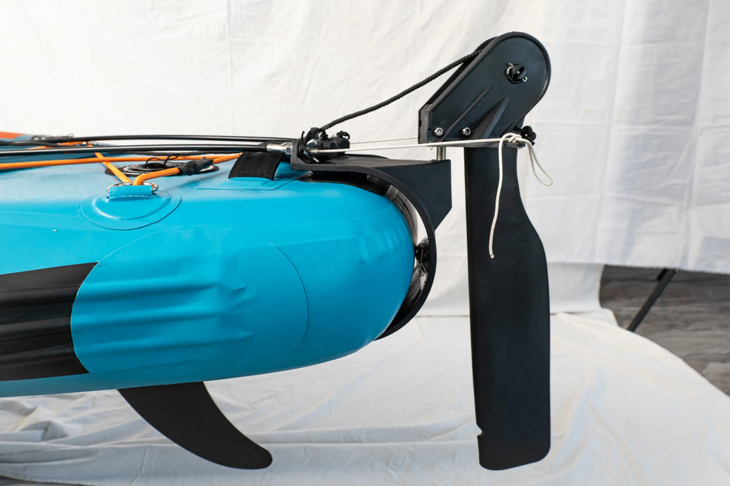 Close-up of a blue and black paddleboard with a white curtain in the background