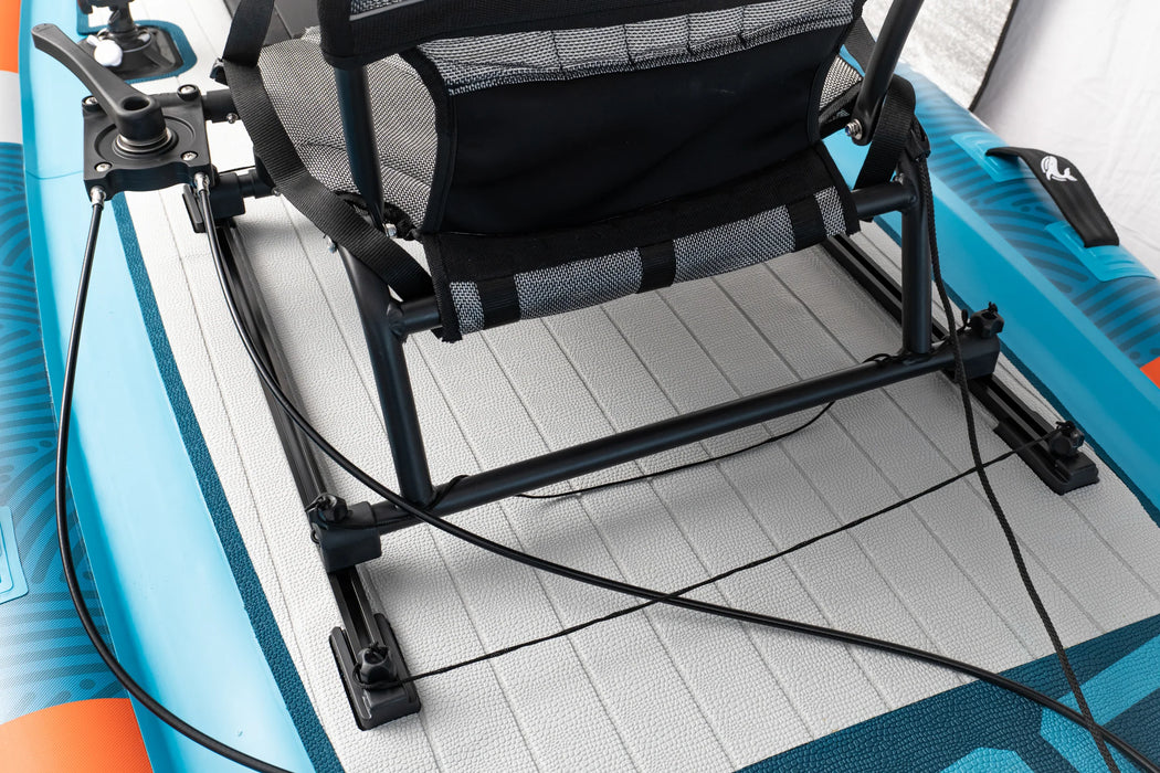 Inflatable kayak with a mounted fishing chair on a white floor.