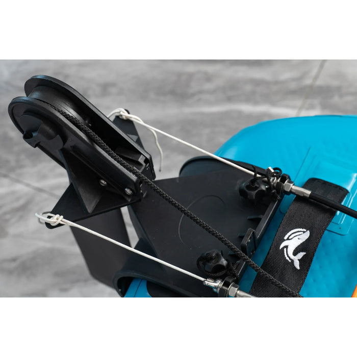 Close-up of a blue helmet with a black chin strap and helmet mount on a gray background