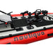 Close-up of an inflatable kayak with 'nautiqua' branding on a red, white, and black background.