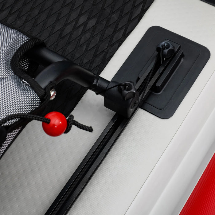 Close-up of a car door handle with a red ball on a vehicle interior.