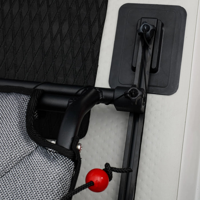 Close-up of a black car door handle with a red handle on a vehicle.