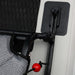 Close-up of a black car door handle with a red handle on a vehicle.