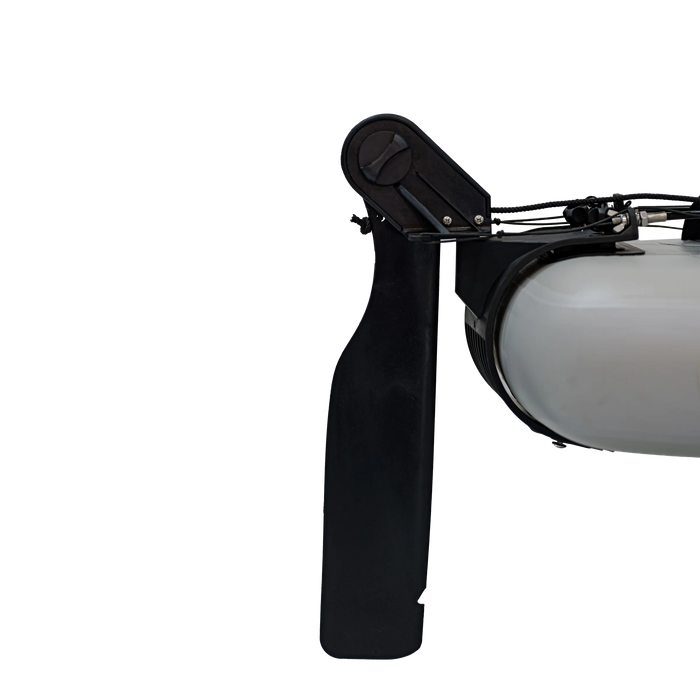 Close-up of a black propeller and white light fixture 